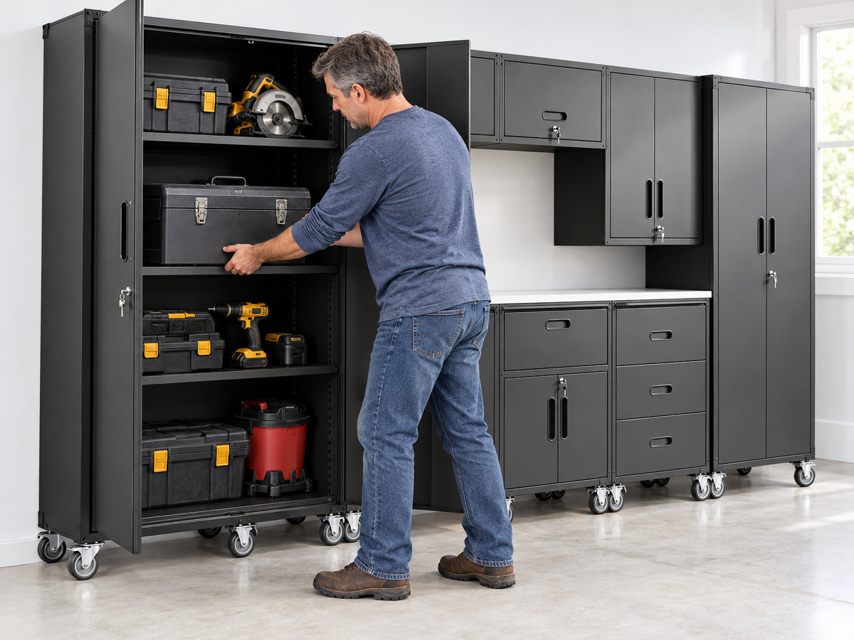 10-Piece Heavy Duty Steel Garage, man slides a heavy toolbox onto a shelf inside an open cabinet, garage workshop