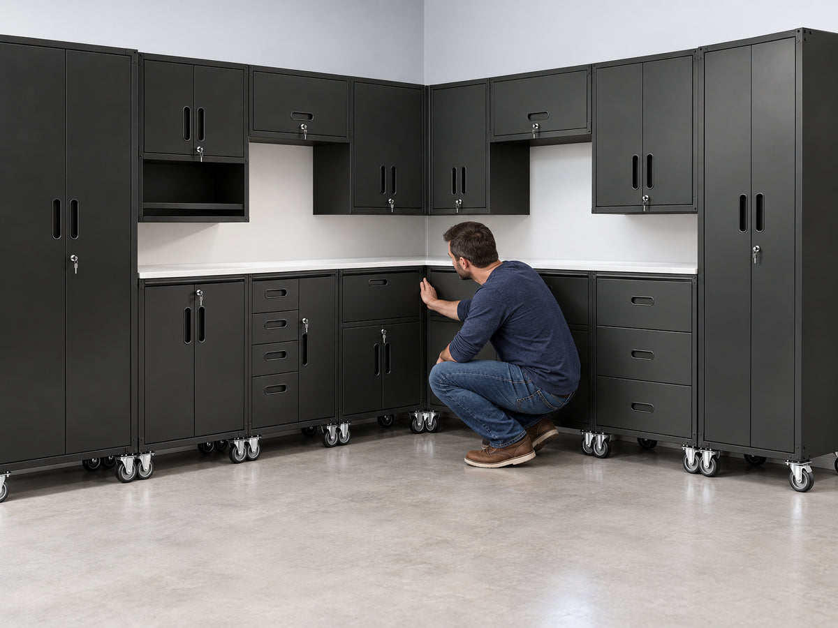 10-Piece Heavy Duty Steel Garage, man crouches at the corner joint where two cabinet units meet